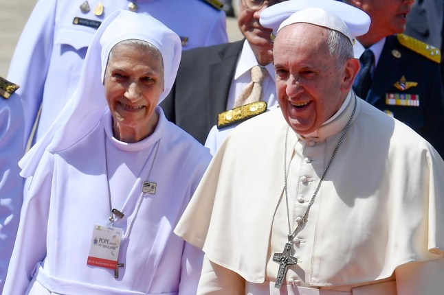 epa08010684 Pope Francis (R) walks with his cousin Ana Rosa Sivori (L) as he arrives at Military Air Terminal of Don Muang Airport in Bangkok, Thailand, 20 November 2019. EPA/CIRO FUSCO