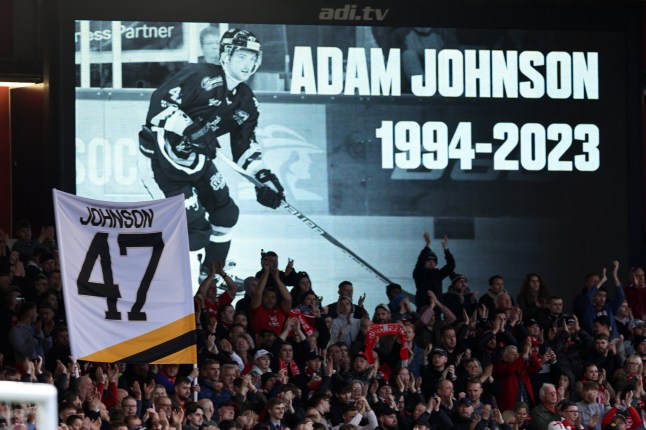 NOTTINGHAM, ENGLAND - NOVEMBER 5: Fans hold a minute applause for Ice Hockey star Adam Johnson on the 47th minute during the Premier League match between Nottingham Forest and Aston Villa at City Ground on November 5, 2023 in Nottingham, England. (Photo by Matthew Ashton - AMA/Getty Images)
