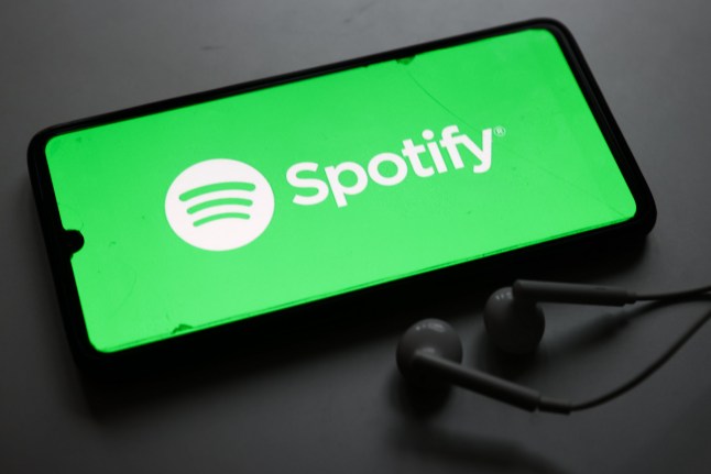 Mandatory Credit: Photo by Beata Zawrzel/NurPhoto/Shutterstock (15129167i) Spotify logo is screened on a mobile phone for illustration photo in Krakow, Poland on February 1st, 2025. Big Companies Logos, Krak?w, Poland - 01 Feb 2025