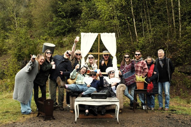 An art project centered around an abandoned sofa in Lydbrook, Gloucestershire. A dumped sofa in the middle of a village has become an unexpected tourist attraction - with hundreds taking photos at the spot. The two-seater settee was dumped on a waste ground in the middle of Lydbrook, Gloucestershire, at the start of April. But local photographer Alex Elton-Wall found potential in the sofa and its location - and has now taken the portraits of more than 150 nearby residents at the popular site. The abandoned sofa even has its own listing on TripAdvisor and a Facebook page titled Lydbrook Lounge with visitors posting photographs of themselves.