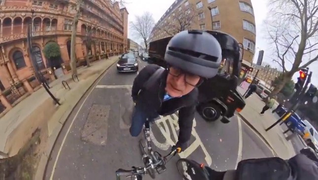 A screengrab of a video showing Jeremy Vine on his bike on the road with his helmet camera on.