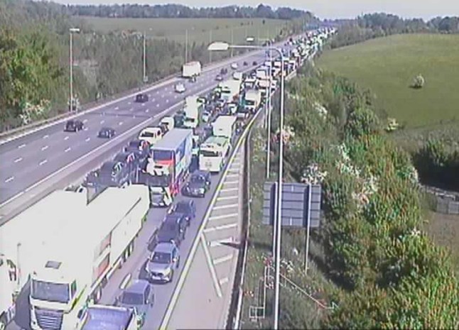 Traffic camera showing cars queueing on the M25 after a lorry crash.