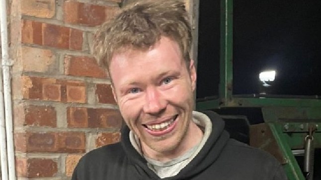 Adam Carruthers pictured smiling.