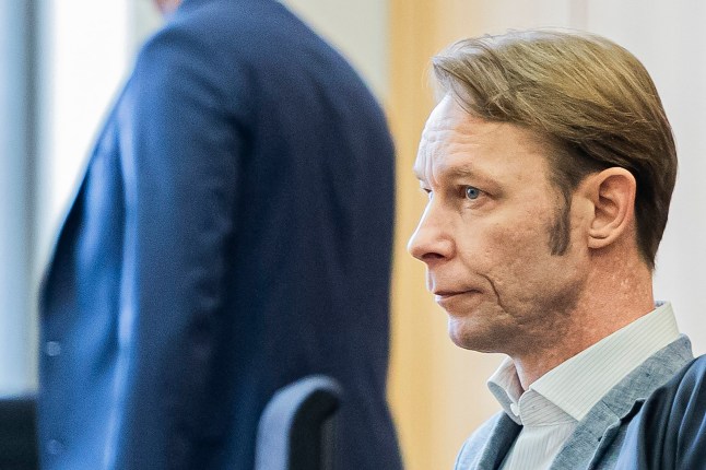 Christian Brueckner stands in the courtroom at Braunschweig District Court before the start of the trial, in Brunswick, Germany, Tuesday Oct. 8, 2024. (Michael Matthey/dpa via AP)