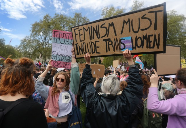 Mandatory Credit: Photo by Martin Pope/ZUMA Press Wire/Shutterstock (15260995o) A supporters of trans rights holds a sign saying 'Feminism Must Include Trans Women' during the protest in Parliament Square. Thousands of Trans rights supporters protested on the streets of Westminster in London following a Supreme Court ruling that defined a 'woman' as someone who had biologically been born a female, leaving trans women as not women in law. Trans Rights Protest In London, England, Uk - 19 Apr 2025