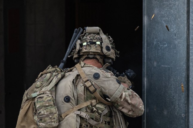 A soldier takes part in urban combat exercise
