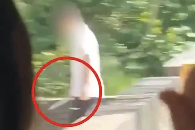 Shocking moment student strolls through school with a massive knife - forcing classes into lockdown as two are injured
