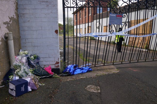 Floral tributes left by the gates of Fairfield Industrial Park in the Bill Quay area of Gateshead where a body believed to be that of 14-year-old Layton Carr was located deceased inside a building following a fire. Eleven boys and three girls, all aged between 11 and 14, have been arrested on suspicion of manslaughter and remain in police custody, Northumbria Police said. Picture date: Sunday May 4, 2025. PA Photo. See PA story POLICE Gateshead. Photo credit should read: Owen Humphreys/PA Wire