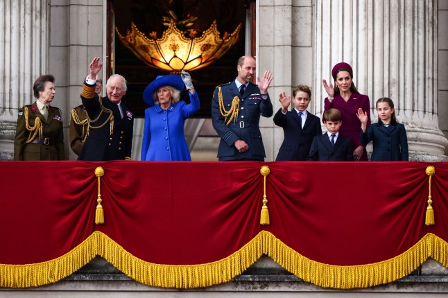 TOPSHOT - (From L to R) Britain's Princess Anne, Princess Royal, Britain's King Charles III, Britain's Queen Camilla, Britain's Prince William, Prince of Wales, Britain's Prince George of Wales, Britain's Prince Louis of Wales, Britain's Catherine, Princess of Wales and Britain's Princess Charlotte of Wales wave to crowds from Buckingham Palace balcony after attending the armed forces procession on May 5, 2025 to celebrate the 80th anniversary of VE Day also known as Victory in Europe Day, marking the end of the Second World War in Europe. (Photo by HENRY NICHOLLS / AFP) (Photo by HENRY NICHOLLS/AFP via Getty Images)