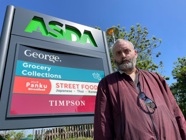 Alan by Asda sign.