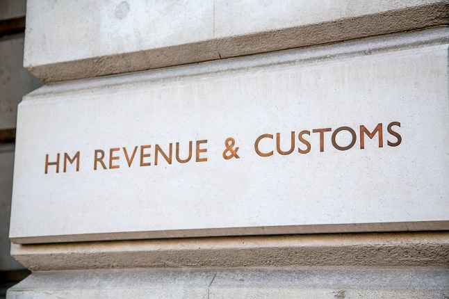HM Revenue & Customs sign incised into the wall outside their headquarters in Whitehall, City of Westminster, London