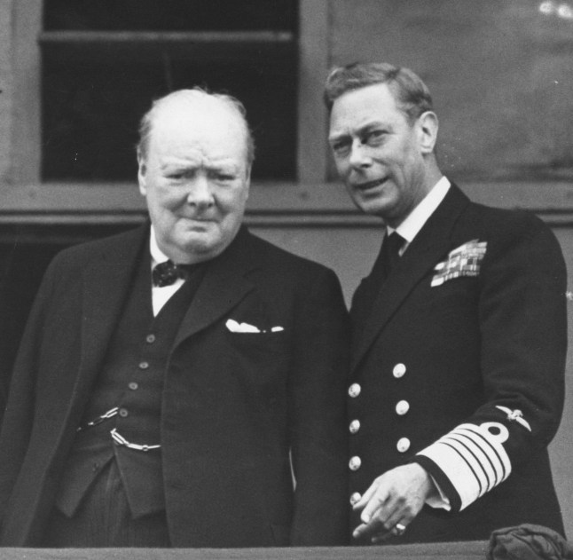 8th May 1945: British statesman and prime minister Sir Winston Churchill (left) and King George VI on the balcony of Buckingham Palace, London, on VE Day. (Photo by Keystone/Getty Images)
