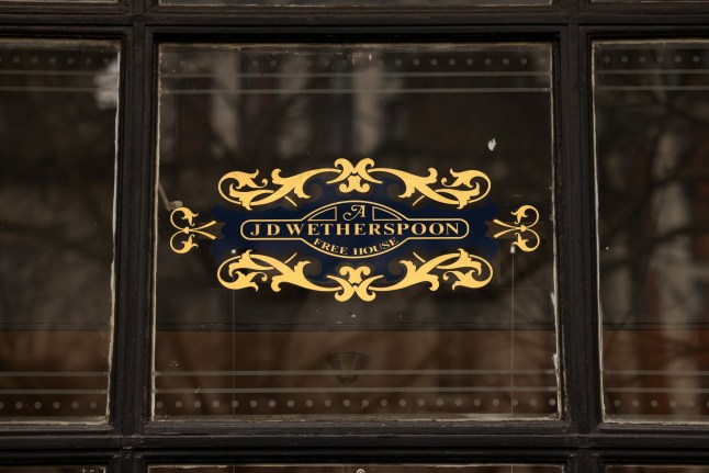 A sign in a window at a J D Wetherspoon Plc pub in central London, UK, on Wednesday, Jan. 15, 2025. UK inflation unexpectedly cooled for the first time in three months in December, prompting traders to increase bets on??Bank of England??interest-rate cuts this year and soothing market jitters surrounding the British economy. Photographer: Hollie Adams/Bloomberg via Getty Images