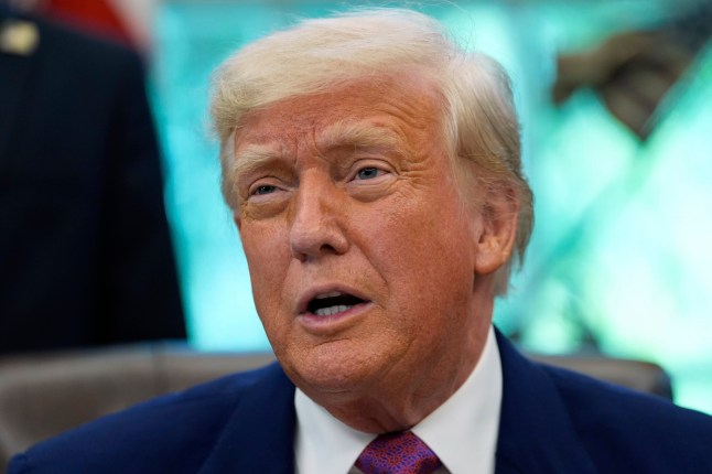 President Donald Trump speaks with reporters as he signs an executive order in the Oval Office of the White House, Friday, May 9, 2025, in Washington. (AP Photo/Alex Brandon)