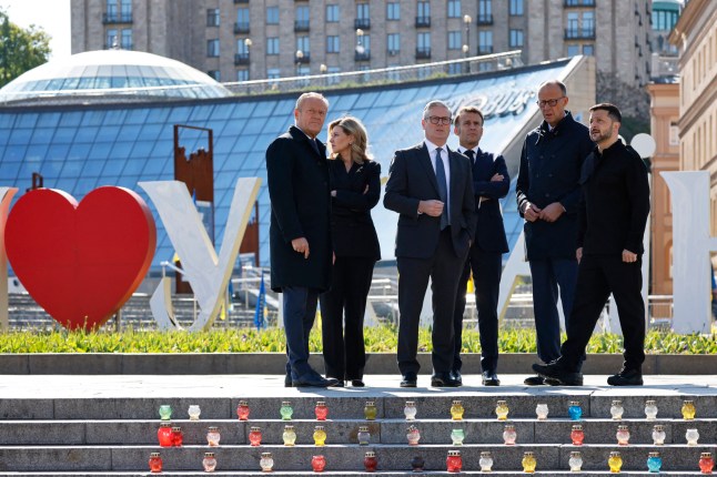 (From L) Poland's Prime Minister Donald Tusk, Olena Zelenska, Britain's Prime Minister Keir Starmer, France's President Emmanuel Macron, Germany's Chancellor Friedrich Merz and Ukraine's President Volodymyr Zelensky visit the Independence Square (Maidan) in Kyiv on May 10, 2025, ahead of a gathering of European leaders in the Ukranian capital. The leaders of Britain, France, Germany and Poland make an unprecedented joint visit to Kyiv on May 10, 2025 for talks with Ukraine's President Volodymyr and to urge Russia to agree a ceasefire, a joint statement said. (Photo by Ludovic MARIN / POOL / AFP) (Photo by LUDOVIC MARIN/POOL/AFP via Getty Images)