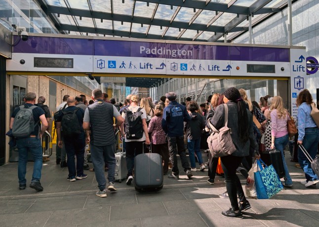 A crowd of passengers being turned away from Elizabeth line services at Paddington after a power cut in London.