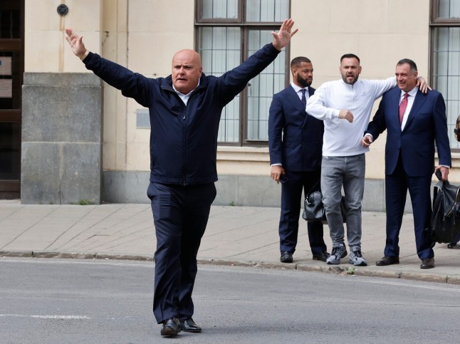 Fred Doe pictured walking out of court free.