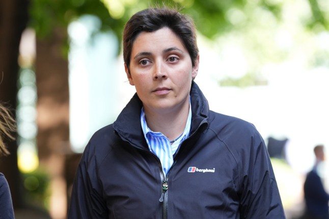 Female police officer with a blurred background.