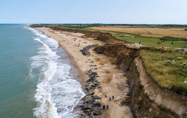 Eroded cliffs near Happisburgh, U.K., on Tuesday, Aug. 3, 2021. The U.K. economy could face hits of more than 12 billion pounds ($15.4 billion) a year by 2050 from coastal damages alone if no action is taken to combat climate change, according to the WWF. Photographer: Jason Alden/Bloomberg via Getty Images
