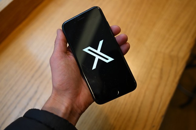 The X logo on a smartphone arranged in London, UK, on Monday, March 10, 2025. User reports indicate X, formerly Twitter, is having issues, according to??Downdetector.?? Photographer: Jaimi Joy/Bloomberg via Getty Images