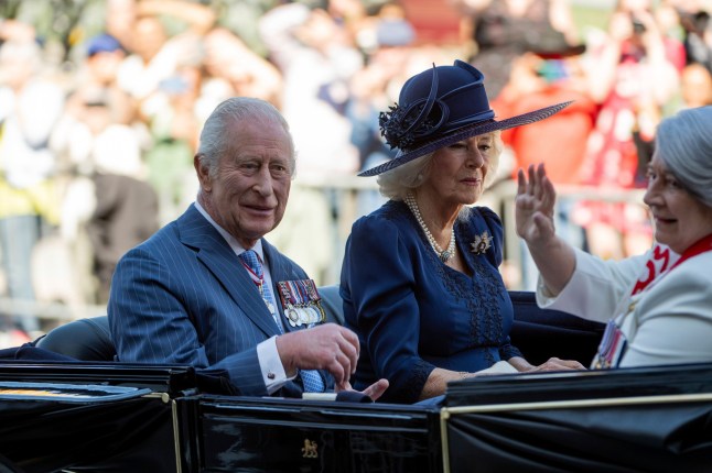 King Charles, Queen Camilla and Gov. Gen. Mary Simon travel in Canada's State Landau towards the Senate of Canada building in Ottawa, Canada, on Tuesday, May 27, 2025. (Spencer Colby/The Canadian Press via AP)
