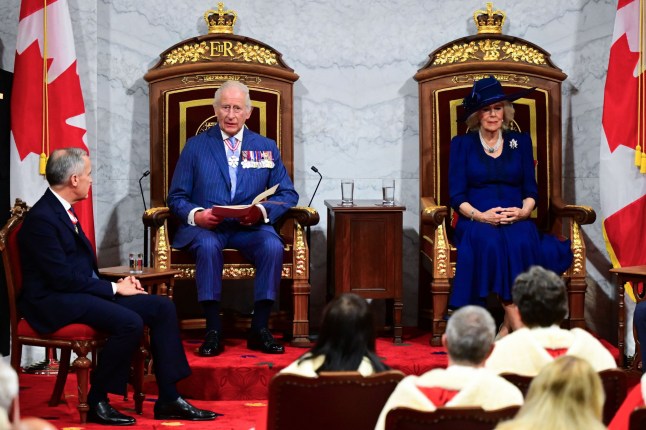 King Charles III and Queen Camilla on the Senate floor with Canadian Prime Minister Mark Carney during the State Opening of the Parliament of Canada, in the Senate Chamber at the Senate of Canada Building, Ottawa, as part of the royal two-day visit to Canada. Picture date: Tuesday May 27, 2025. PA Photo. See PA story ROYAL Canada. Photo credit should read: Victoria Jones/PA Wire