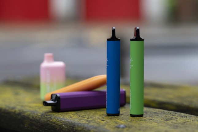 Single use vapes on a table.