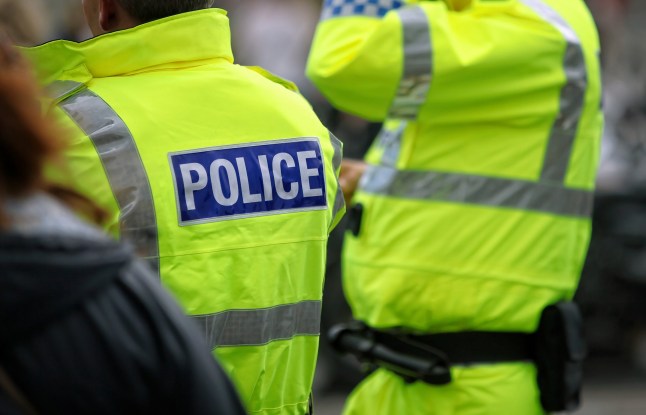 Police officers in hi-visibility jacket policing crowd control at an outside UK event; Shutterstock ID 2315420565; purchase_order: -; job: -; client: -; other: -