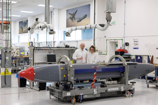 Louise Holmes, MBDA UK Deputy Managing Director, shows Defence Secretary John Healey a storm shadow missile on an assembly line at the MBDA Storm Shadow factory on May 31, 2025 in Stevenage, England. Dan Kitwood/Pool via REUTERS