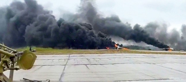OSINTtechnical @Osinttechnical ? 2h Russian air defense crew filming a burning Olenya airbase, with multiple Russian Tu-95 bombers seen ablaze after a Ukrainian strike this afternoon.