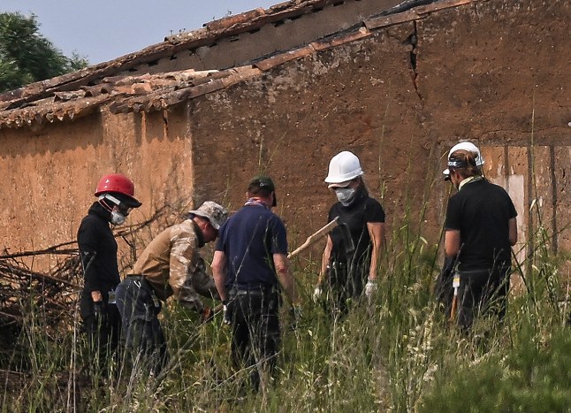 German investigators work during a new search operations amid the investigation into the disappearance of Madeleine (or Maddie) McCann at Atalaia, Lagos in Algarve on June 3, 2025. Portuguese police and about 25 German investigators on June 3, 2025 scoured undergrowth and an abandoned building in Portugal in the hunt for British toddler Madeleine McCann, with police hoping to find evidence that could implicate a convicted German sex offender in her disappearance 18 years ago. (Photo by Patricia DE MELO MOREIRA / AFP) (Photo by PATRICIA DE MELO MOREIRA/AFP via Getty Images)