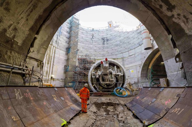 HS2 tunnelling construction with boring machine and workers.