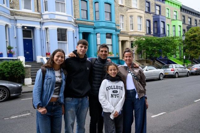 London, UK, 4th June, 2025. Residents of Lancaster Road have painted their houses black in an attempt to dissuade tourists from taking selfies in front of their properties. The street has become a magnet for social media influencers and tourists. Picture shows the Obeid family on holiday from Argentina - Guillermo (father), Tete, (mother) Conrado (son) Consuelo (daughter) and Justina (younger daughter).