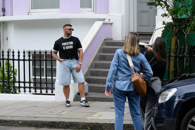 London, UK, 4th June, 2025. Residents of Lancaster Road have painted their houses black in an attempt to dissuade tourists from taking selfies in front of their properties. The street has become a magnet for social media influencers and tourists. Picture shows tourists talking photographs and ???selfies??? in front of the multi-coloured houses.