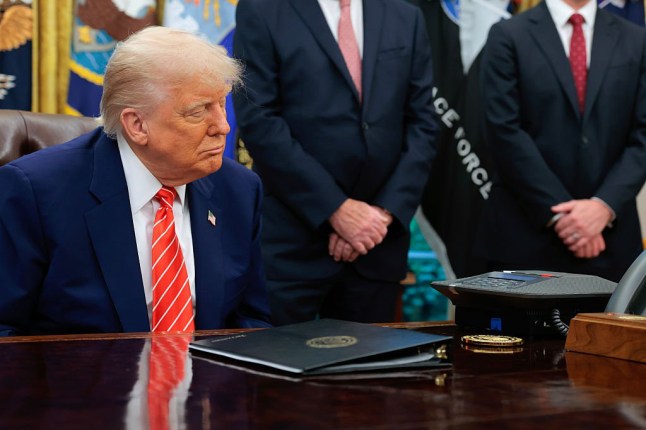 WASHINGTON, DC - MAY 08: U.S. President Donald Trump listens as Prime Minister Keir Starmer of Britain speaks to him on the speaker phone in the Oval Office at the White House on May 08, 2025 in Washington, DC. During his remarks Trump spoke about a trade deal with the United Kingdom that he announced today on Truth Social. (Photo by Anna Moneymaker/Getty Images)