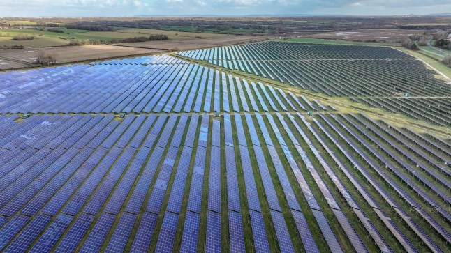 DEESIDE, WALES - FEBRUARY 25: An aerial view of the Shotwick Solar Energy Park on February 25, 2025 in Deeside, Wales. The array of photovoltaic solar panels at the Shotwick site produces 72.2 mega watts of electricity per year and is spread over 250 acres, currently making it the largest solar farm in the UK. Energy regulator Ofgem has announced the energy price cap will rise 6.4% in April, marking the third consecutive increases on gas and electricity charges. (Photo by Christopher Furlong/Getty Images)