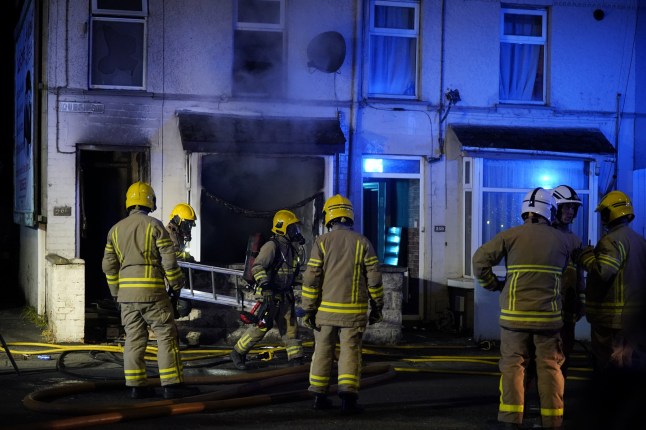 Emergency services outside a house in Ballymena, as people take part in a protest over an alleged sexual assault in the Co Antrim town. Police used water cannon to disperse protesters engaged in serious disorder for a second night in Ballymena, as fireworks and masonry were thrown at officers. Picture date: Tuesday June 10, 2025. PA Photo. See PA story ULSTER Ballymena. Photo credit should read: Niall Carson/PA Wire