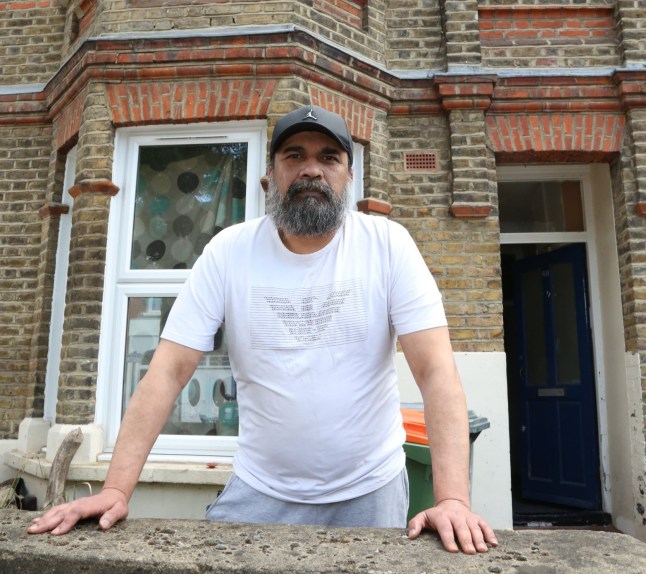 Sanjay stood outside his home.