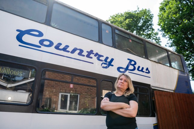 Wendy Salmon, who is being forced to move her bus from her front garden. Frimley, 13th June 2025 A woman has been slapped with an ASBO and forced to remove a bus being renovated in her drive - after complaints from 'snobby' neighbours it was 'ruining the ambience.' Wendy Salmon parked the vehicle on the drive at the end of a cul-de-sac in a posh Surrey street as she wanted to turn it into a cafe business. But she accused one neighbour of 'rallying' the street against her by complaining. And despite the council accepting she was 'not breaking any laws' she has been hit with a CPN and ordered to remove it by 20 June following a bitter two year legal battle.