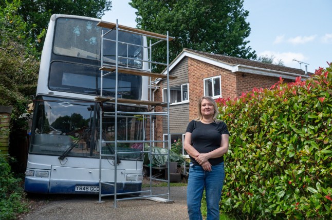 Wendy Salmon, who is being forced to move her bus from her front garden. Frimley, 13th June 2025 A woman has been slapped with an ASBO and forced to remove a bus being renovated in her drive - after complaints from 'snobby' neighbours it was 'ruining the ambience.' Wendy Salmon parked the vehicle on the drive at the end of a cul-de-sac in a posh Surrey street as she wanted to turn it into a cafe business. But she accused one neighbour of 'rallying' the street against her by complaining. And despite the council accepting she was 'not breaking any laws' she has been hit with a CPN and ordered to remove it by 20 June following a bitter two year legal battle.