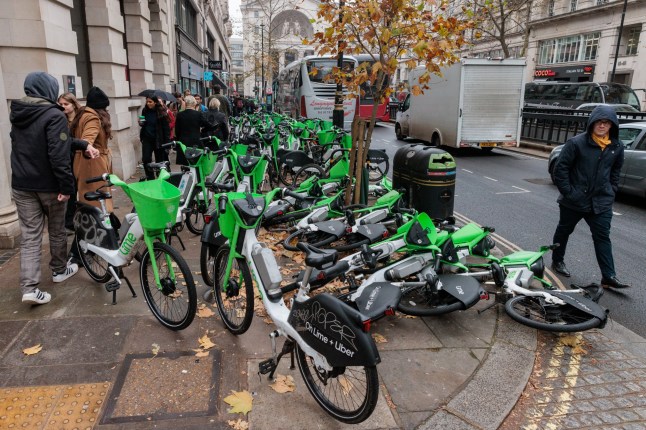 Rental bikes are pictured scattered across a pavement on 4th December 2024 in London, United Kingdom.