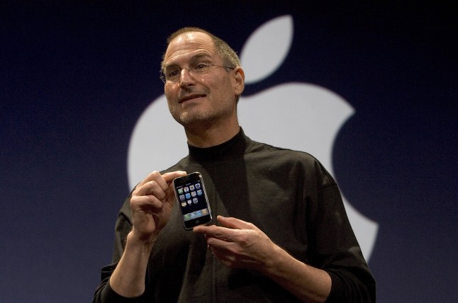 SAN FRANCISCO, CA - JANUARY 9: Apple CEO Steve Jobs holds up the new iPhone that was introduced at Macworld on January 9, 2007 in San Francisco, California. The new iPhone will combine a mobile phone, a widescreen iPod with touch controls and a internet communications device with the ability to use email, web browsing, maps and searching. The iPhone will start shipping in the US in June 2007. (Photo by David Paul Morris/Getty Images)