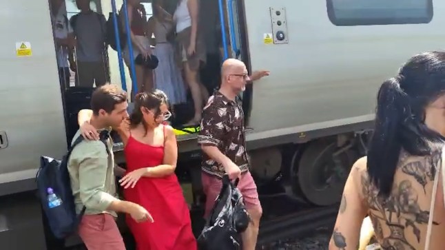 Passengers getting evacuated from Brighton train 'after they hit emergency buttons as temperature was getting too hot' Credit: Connor Moore