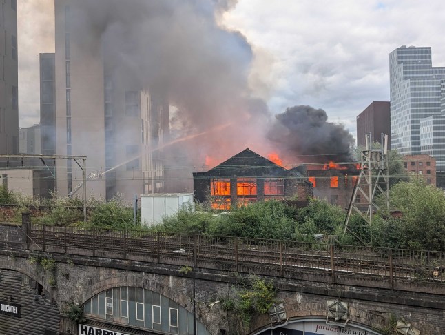 Huge fire breaks out in Manchester with people evacuated and train lines blocked post thumbnail image