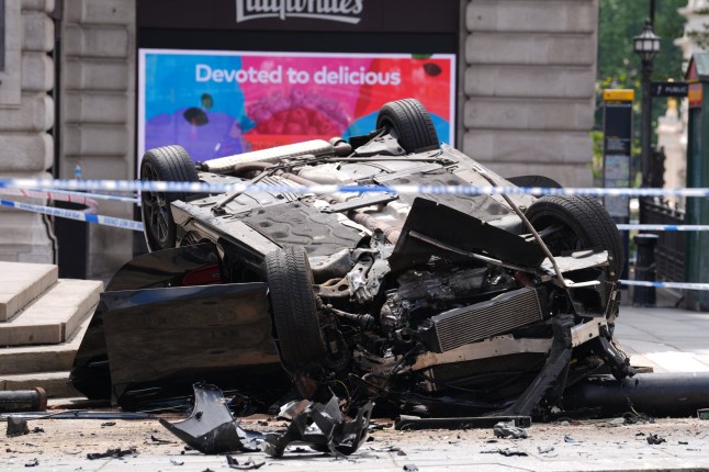 The scene after a car crashed near the Shaftesbury Memorial Fountain, popularly known as Eros in London's Piccadilly Circus