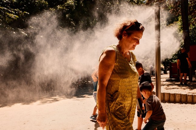 Mandatory Credit: Photo by Adnan Farzat/NurPhoto/Shutterstock (15379371d) People cool off and enjoy a water spray at Montsouris Park during a heatwave in Paris, France, on June 29, 2025. Authorities across southern Europe urged people to seek shelter and protect the most vulnerable as soaring temperatures swept across Spain, Portugal, Italy, and France in the first major heatwave of the summer. Heatwave In France, Paris - 29 Jun 2025