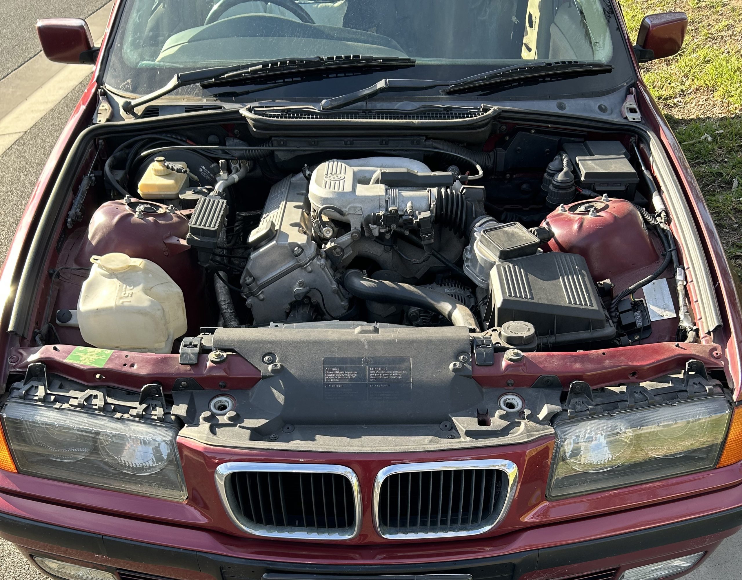 BMW pulled over without bonnet, driver’s seat in Melbourne post thumbnail image
