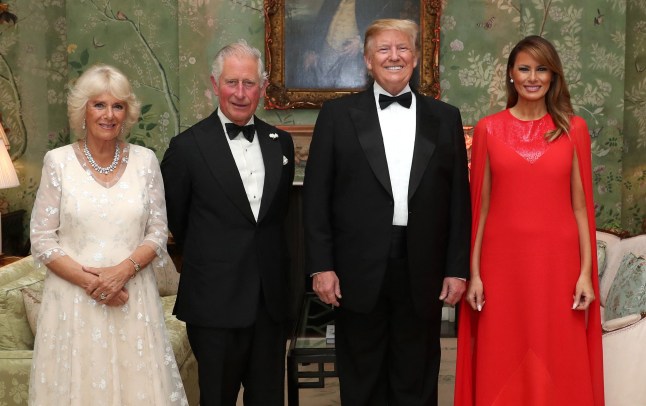 US President Donald Trump (2R), US First Lady Melania Trump (R), Britain's Prince Charles, Prince of Wales (2L), and his wife Britain's Camilla, Duchess of Cornwall, pose for a photograph ahead of a dinner at Winfield House, the residence of the US Ambassador, where US President Trump is staying whilst in London, on June 4, 2019, on the second day of the US President's three-day State Visit to the UK. US President Donald Trump turns from pomp and ceremony to politics and business on Tuesday as he meets Prime Minister Theresa May on the second day of a state visit expected to be accompanied by mass protests. (Photo by Chris Jackson / POOL / AFP) (Photo by CHRIS JACKSON/POOL/AFP via Getty Images)