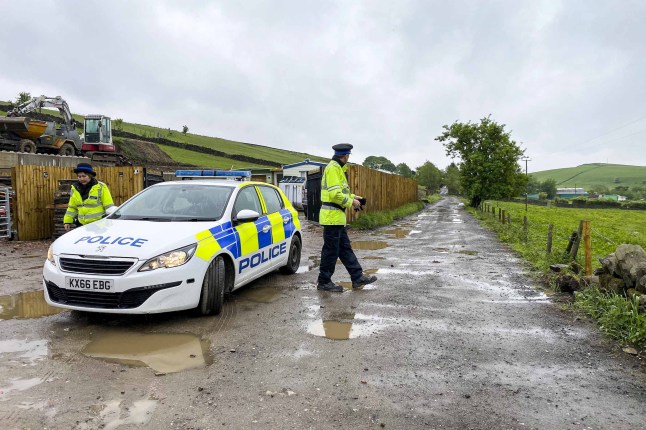 FILE PHOTO - Police at the scene after boy, 3, dies in dog attack in Milnrow, Rochdale on May 16 2022. Photo released July 4 2024. A man and a woman have been charged in connection of the death of three-year-old Daniel Twigg from May 2022.Daniel sadly died after sustaining injuries as a result of being attacked by a dangerous dog on Tunshill Lane, Milnrow in Rochdale on Sunday 15 May 2022.Mark Twigg (31/03/1982) of King Street, Radcliffe and Joanne Bedford (16/10/1987) of the same address, have been charged with gross negligence manslaughter.They have been notified to attend a scheduled court appearance at Manchester and Salford Magistrates Court on Wednesday 31 July 2024.