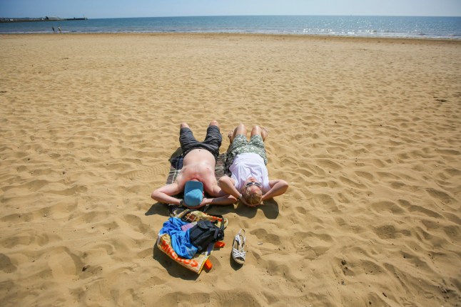 Members of the public soak up the sun in Bridlignton, East Yorkshire, as temperatures are set to reach 31C in the East of England this weekend. June 19 2025.
